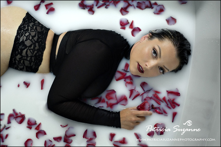 milk bath boudoir with red rose petals and sheer black top